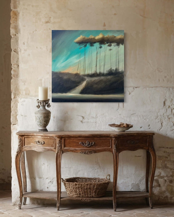 Ethereal series #07 artwork with teal sky and golden tree highlights displayed above a vintage wooden console table in a rustic room