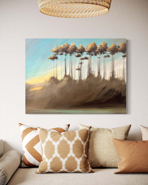 Ethereal series #09 artwork featuring a teal sky, sunset, and golden tree tips on gallery-wrapped canvas in a cozy living room setting